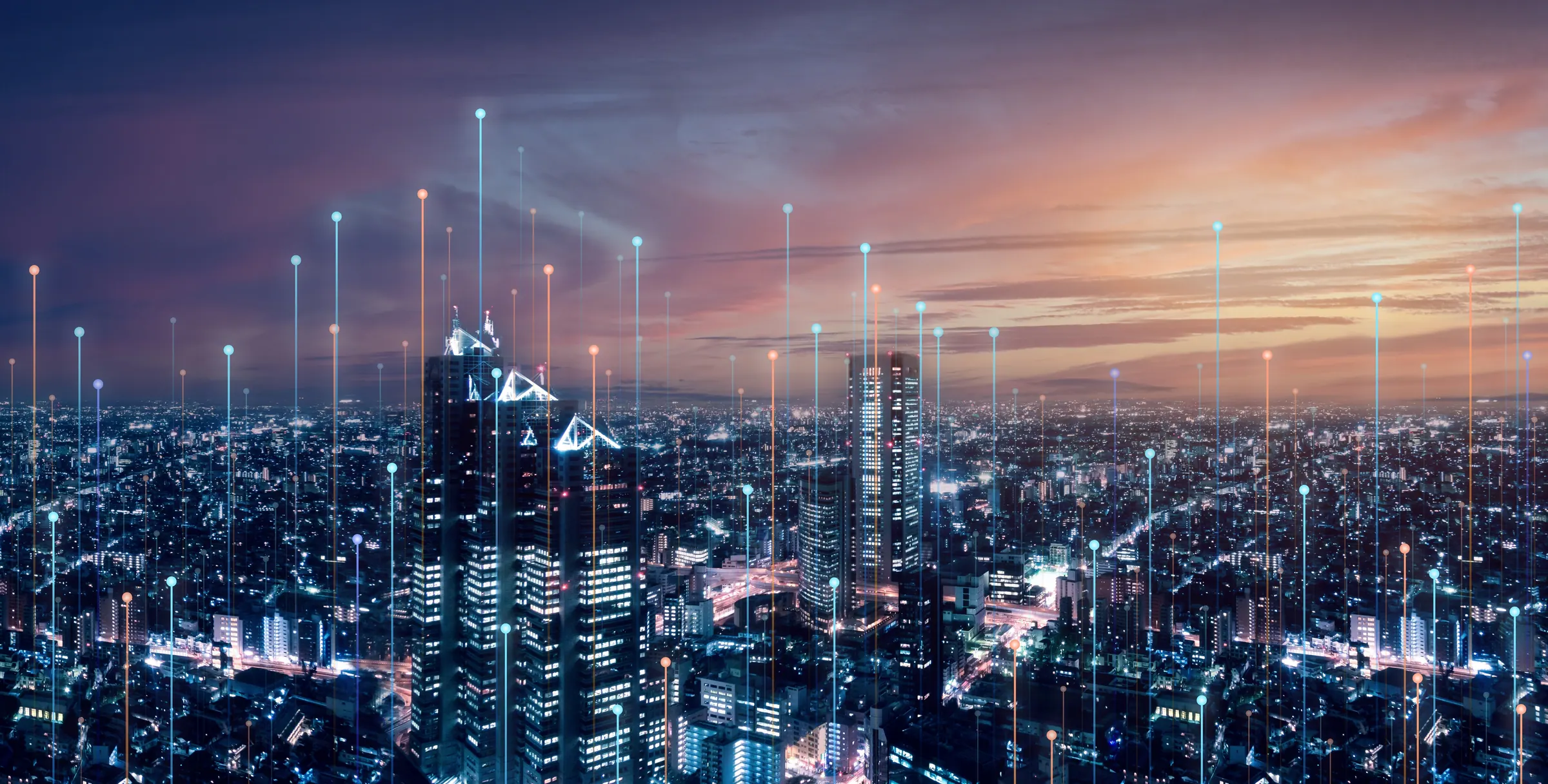 City skyline at dusk overlaid with connected network lines