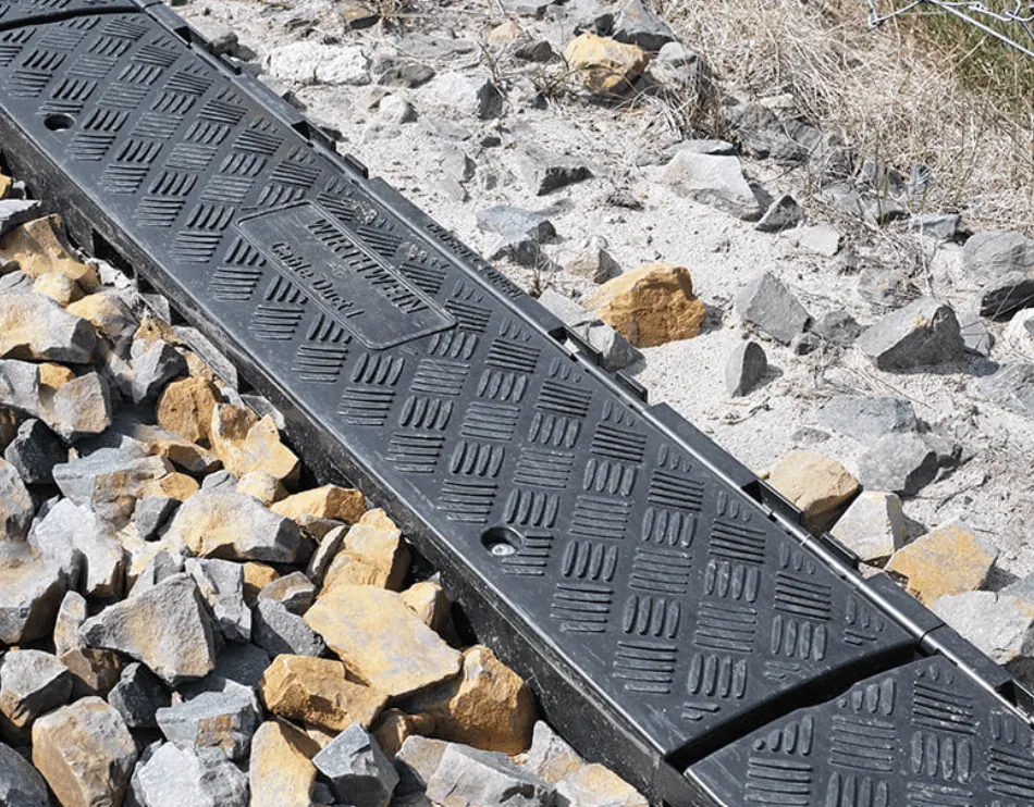 Wirthwein plastic cable duct trough laid in a stone bed